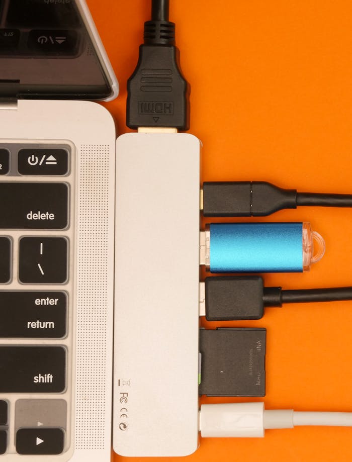 pexels-photo-7054723
A Close-Up Shot of a USB Hub Attached on a Laptop